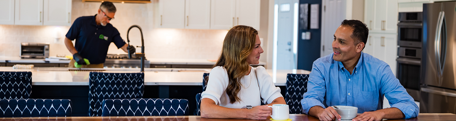 Handymand fixing the Faucet in the kitchen
